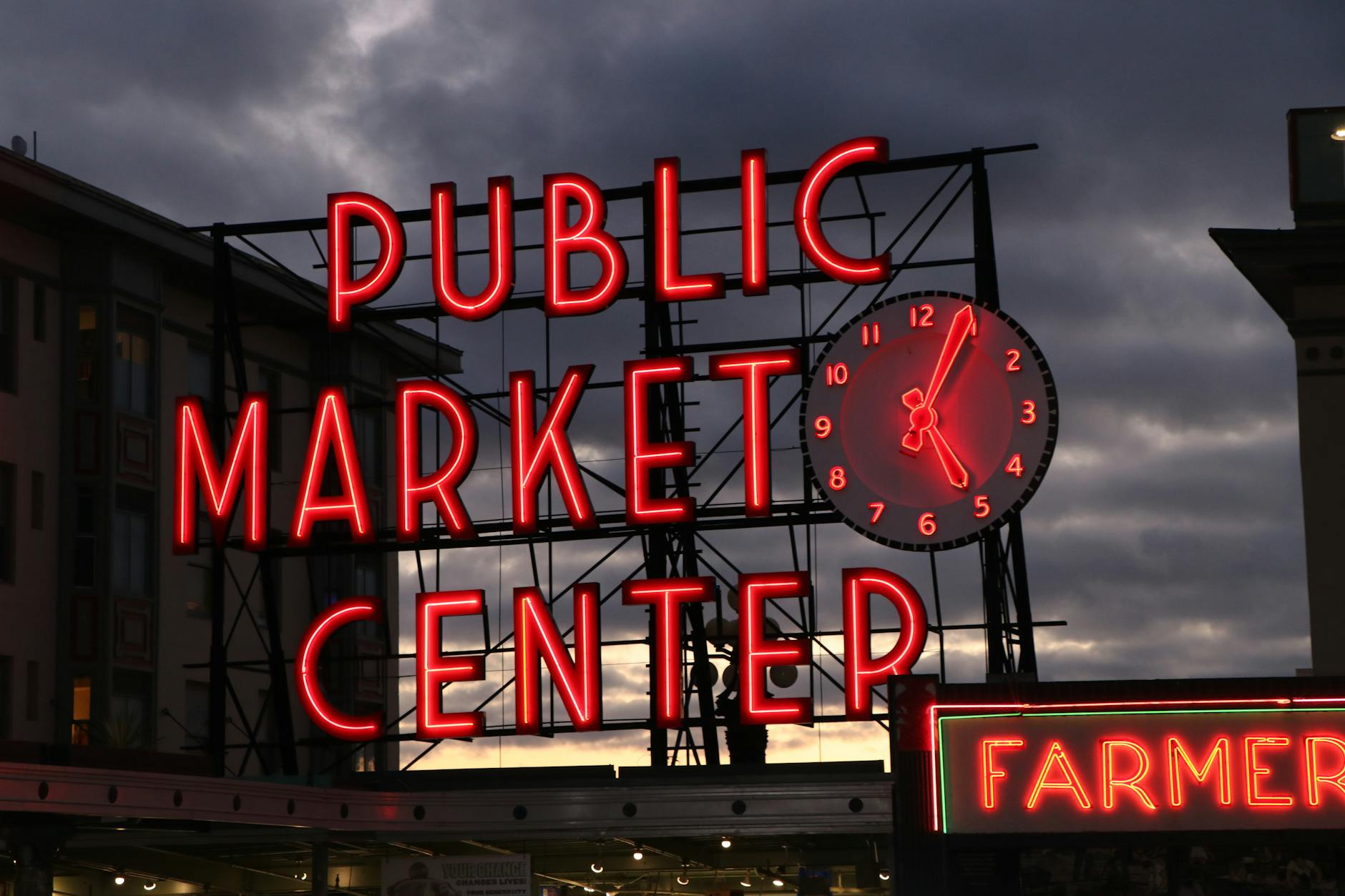 iconic pike place market sign at dusk in seattle